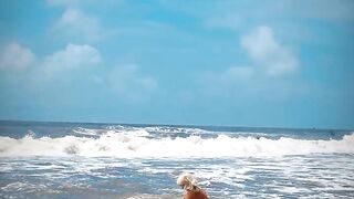 Tik Tok. Beach Voyeur looks on Blonde Teen Enjoying Topless in the Waves.