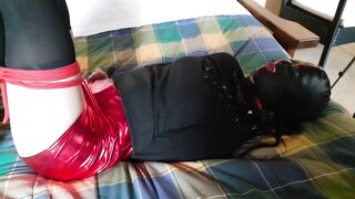 Hogtied and masked in stockings and high heels Trained sub