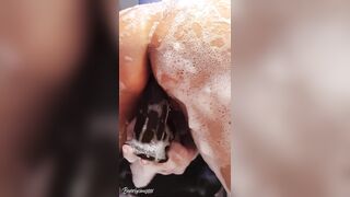 Busty MILF caught showering and masturbating with a huge dildo