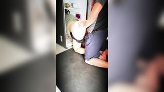 She gets stuck in the fridge, he tries to help her and spills the milk