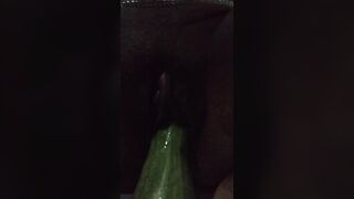 Milf playing with a cucumber