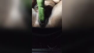 Milf playing with a cucumber