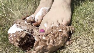 Smashing a cake with my feet. The chocolate and cream gateaux feels so nice between my toes