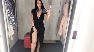 Busty hot brunette is trying dresses in the store