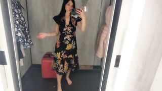 Busty hot brunette is trying dresses in the store