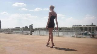 Black high heel sandals by the river