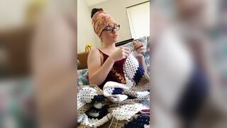 Creature crocheting and singing a tune