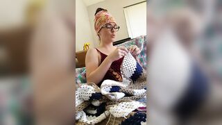 Creature crocheting and singing a tune