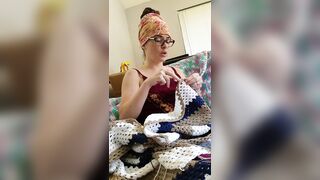 Creature crocheting and singing a tune