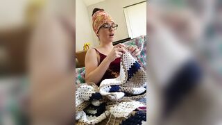 Creature crocheting and singing a tune