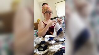 Creature crocheting and singing a tune