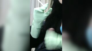 Smoking Wife in Green Rubber Gloves Handjob