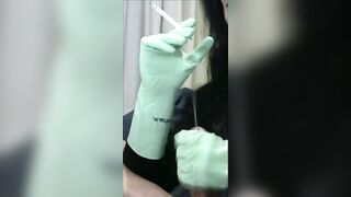 Smoking Wife in Green Rubber Gloves Handjob