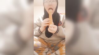 Hijab girl sucks her dildo