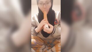 Hijab girl sucks her dildo