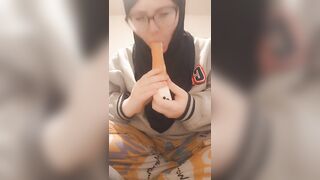 Hijab girl sucks her dildo