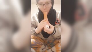 Hijab girl sucks her dildo