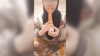 Hijab girl sucks her dildo