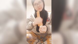 Hijab girl sucks her dildo