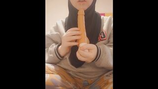 Hijabi girl sucks her dildo