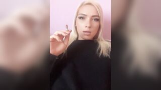 Sexy blonde girl smoke a cigarette