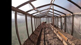 Nude house wife working in the greenhouse