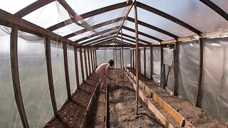 Nude house wife working in the greenhouse