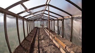 Nude house wife working in the greenhouse