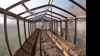 Nude house wife working in the greenhouse